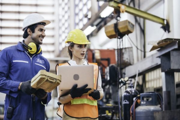 male-and-female-industrial-worker-discuss-project-and-using-laptop-controlling-machine.jpg